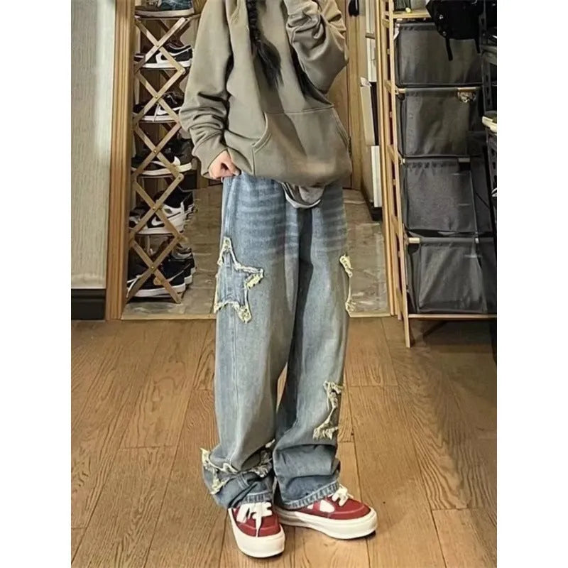 Blue women's high-waisted straight-leg denim jeans on a neutral background.