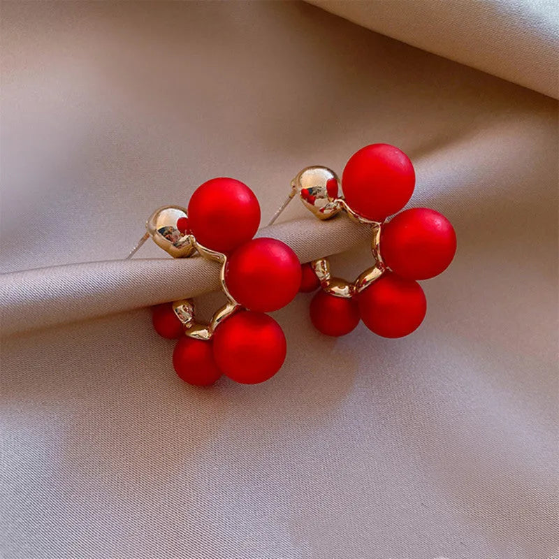 Red bell earrings for women with alloy construction also available in white