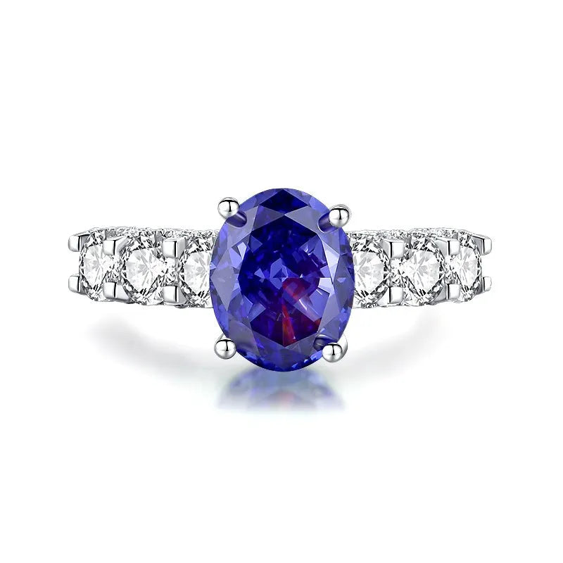 Heart-shaped sterling silver ring with a faceted colour zircon stone on a white background.