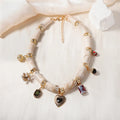 Heart-shaped resin and plastic pendant necklace with an electroplated finish for women.