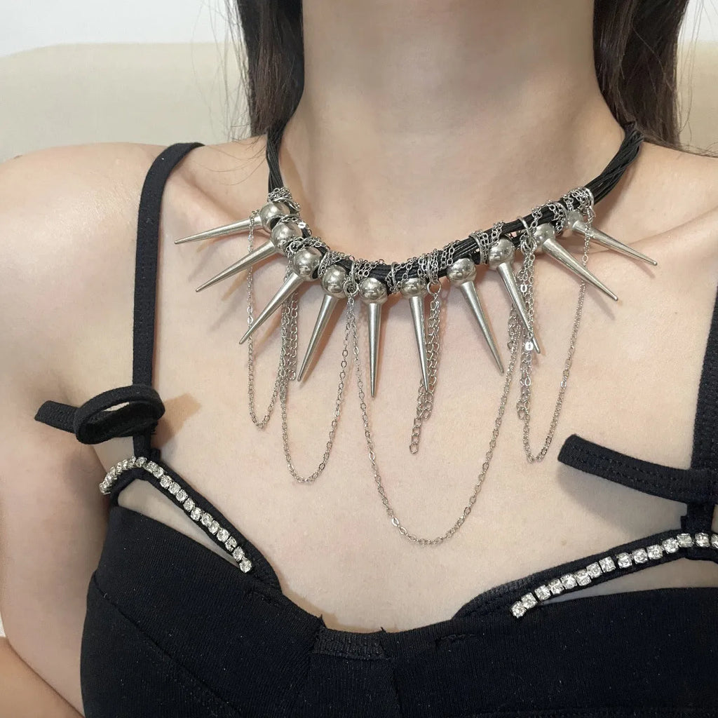 Leather necklace with round beads, a winding tassel, and point rivets in an electroplated picture colour.