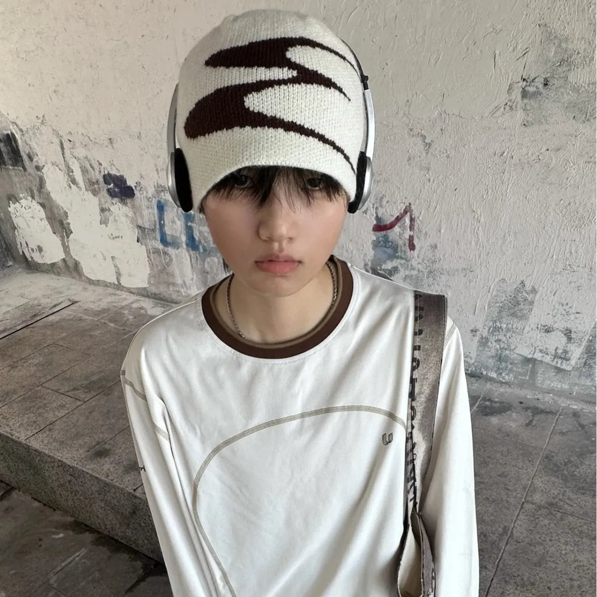 Unisex acrylic knitted beanie hat in black, shown on a head model, size M for 56-58cm circumference.