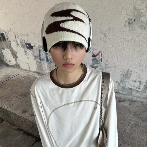 Unisex acrylic knitted beanie hat in black, shown on a head model, size M for 56-58cm circumference.