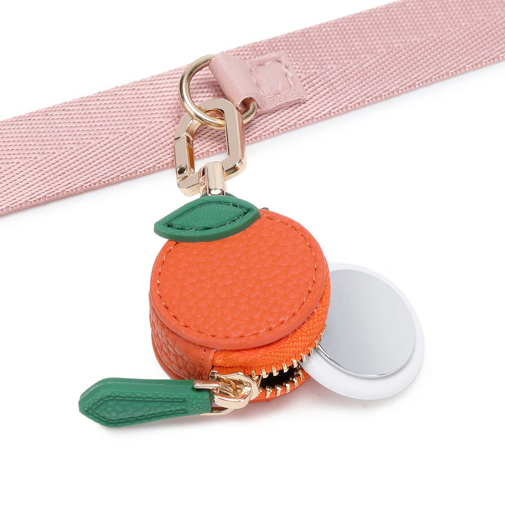 Mini solid colour PU leather coin pouch keychain in cherry red on a keyring.