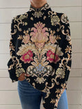 Black 3D pattern turtleneck long sleeve sweater on a hanger showing loose fit and textured knit.