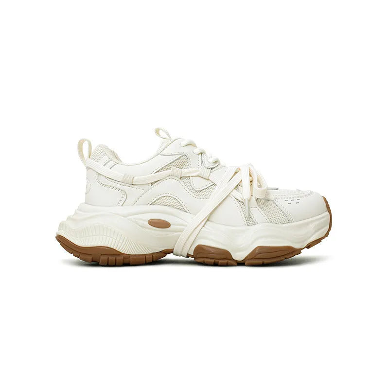 Women's beige and white platform sneakers with round toe and front lace-up design on a composite sole.