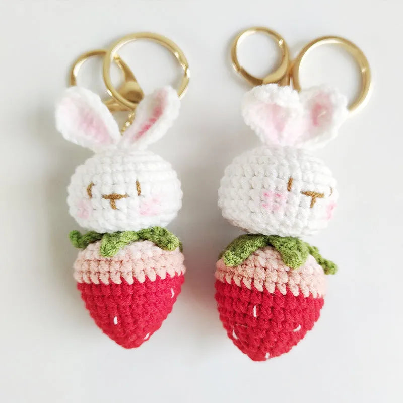 Hand-woven white rabbit strawberry pendant keychain made from four-strand doll wire.