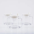 Transparent spill-proof plastic drinking cup with modern design on a plain background.