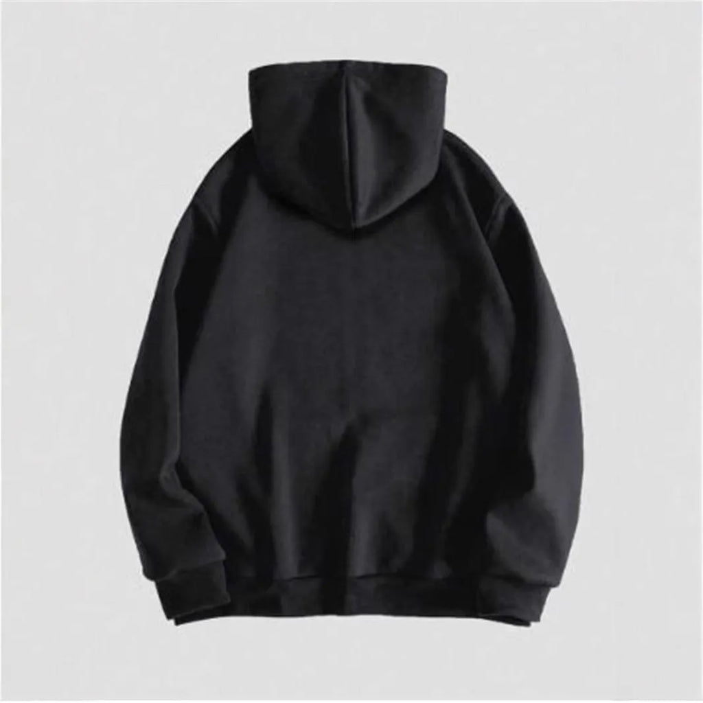 Man wearing a black hooded sweatshirt with a large white skull print on the front.