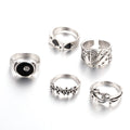 Black alloy ring featuring a detailed retro spade card design on an adjustable band.