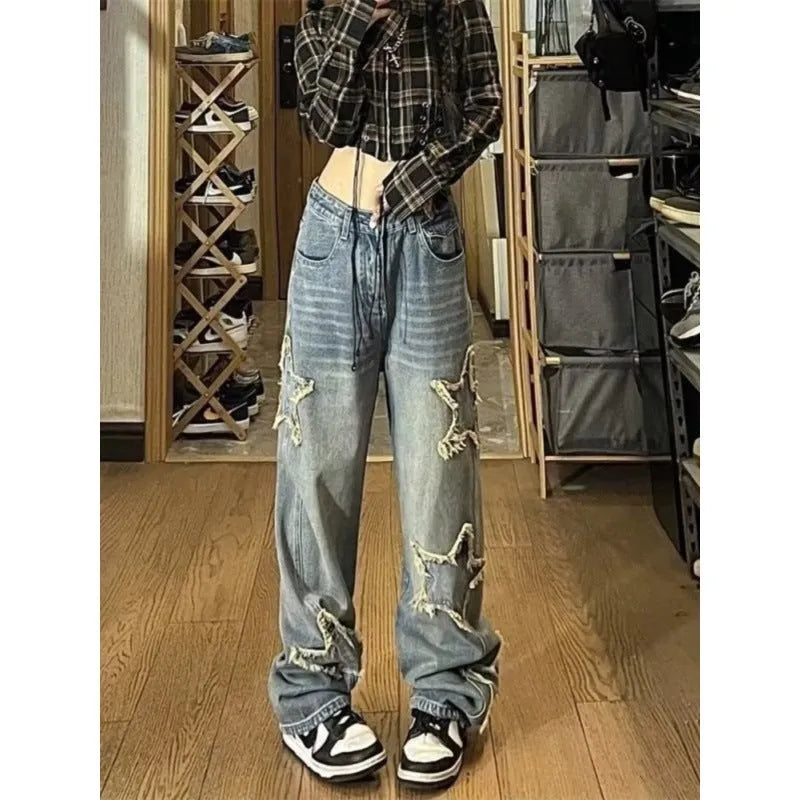 Blue women's high-waisted straight-leg denim jeans on a neutral background.