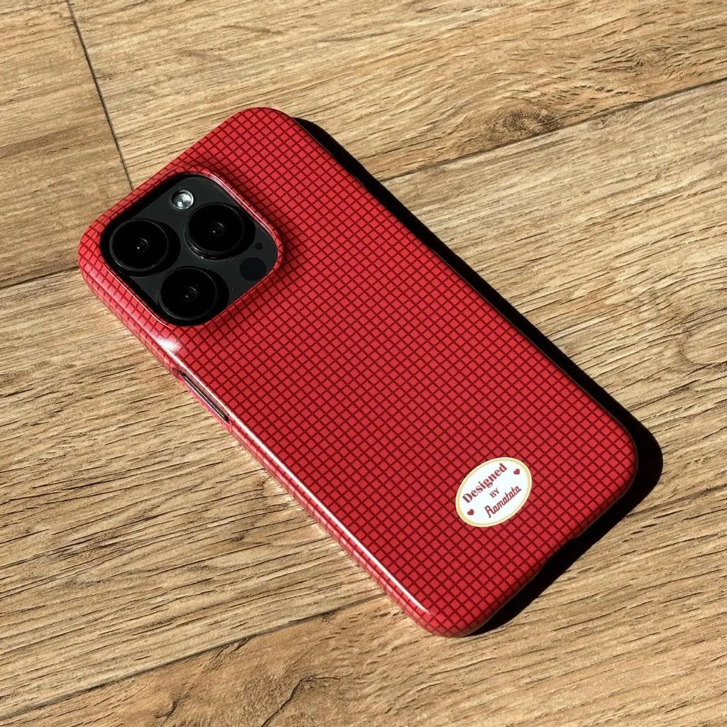 iPhone 15 Pro Max phone case with red and orange plaid design on glossy and frosted feilin shells.