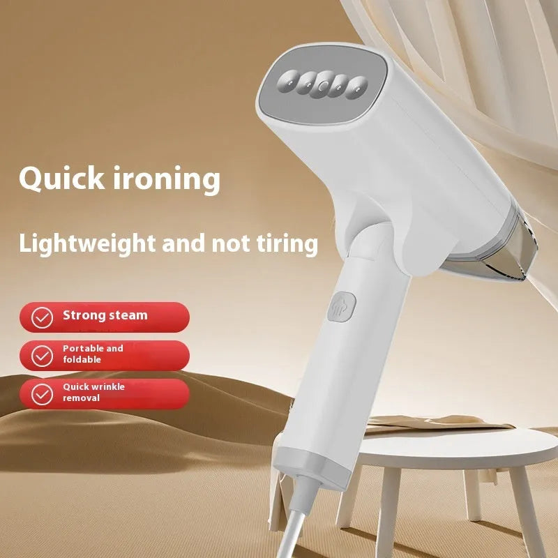 Blue handheld garment steamer unit with water tank and nozzle, showing compact size.