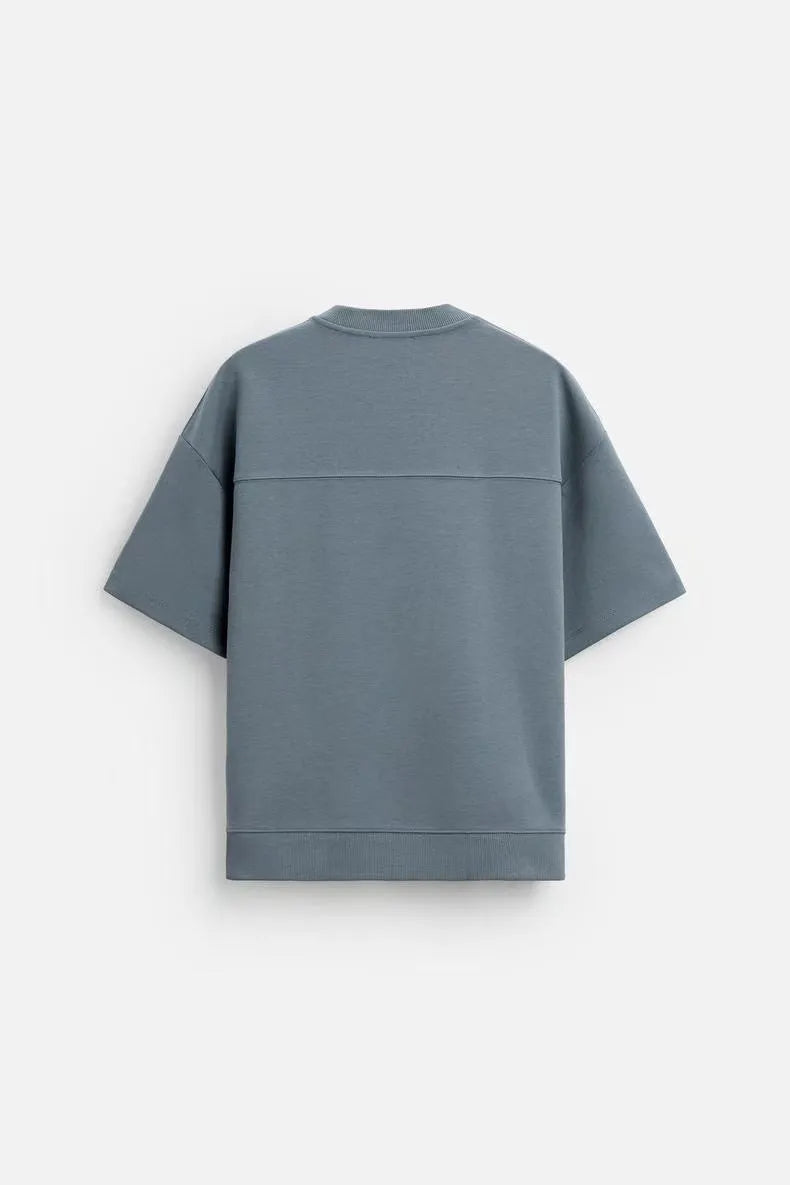 Loose double-sided cloth texture short sleeve top and matching shorts set on a hanger.