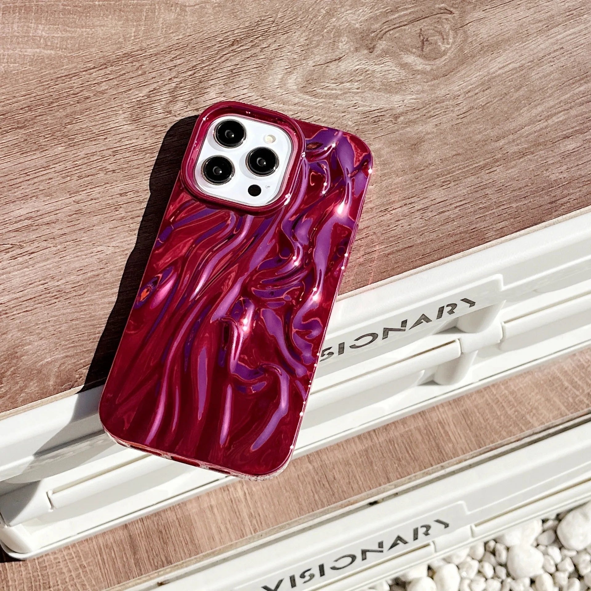Soft TPU iPhone case with a textured three-dimensional pleated pattern in an electroplated colour finish.