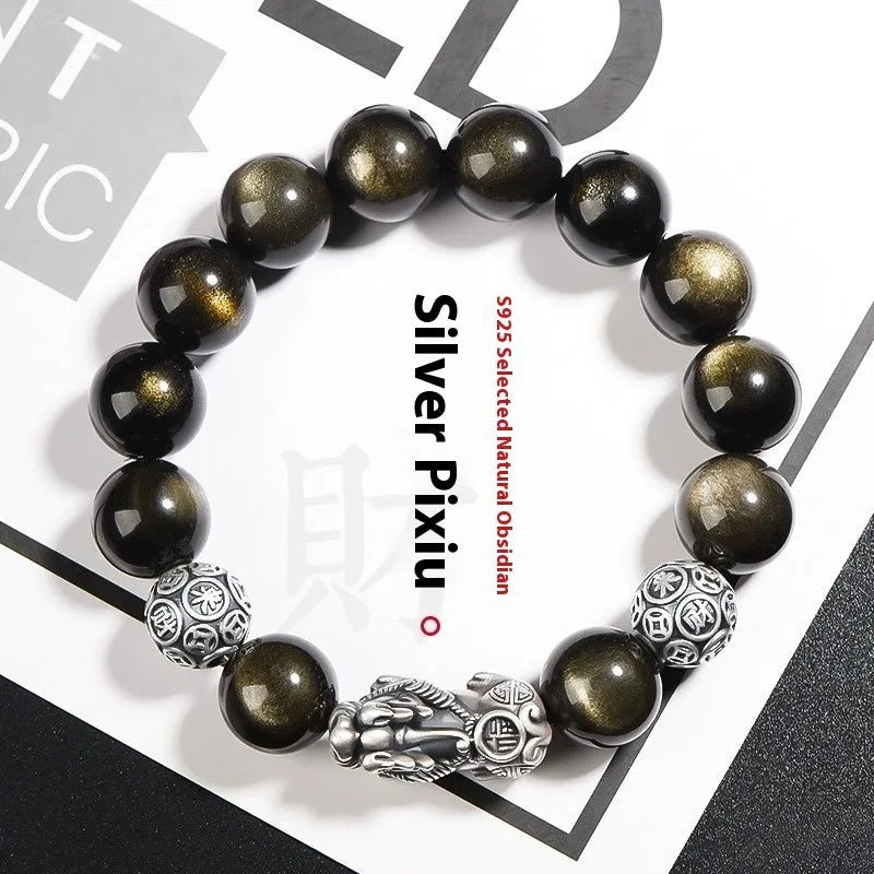 Men's geometric obsidian and sterling silver bracelet showing polished stones and metallic framework
