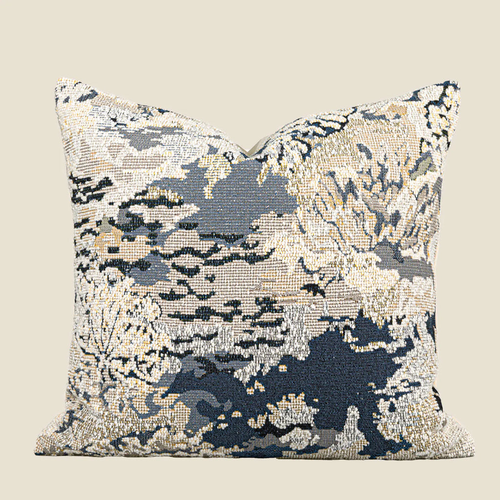 Antique blue wool-blended square throw pillow with abstract floral pattern on a neutral sofa
