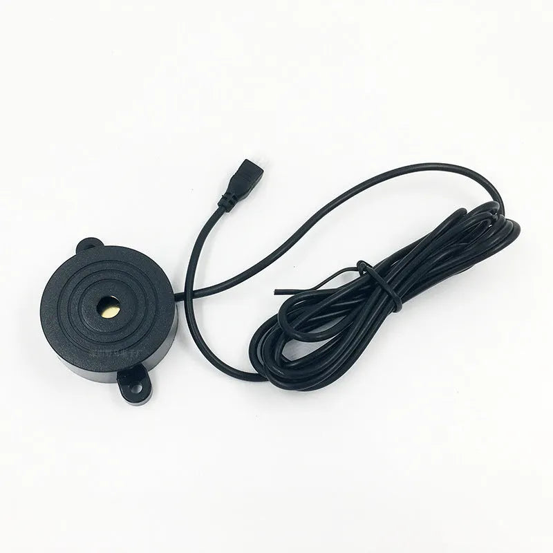 Four-probe pure buzzer reversing radar with ultrasonic sensors in different colours on a car bumper.