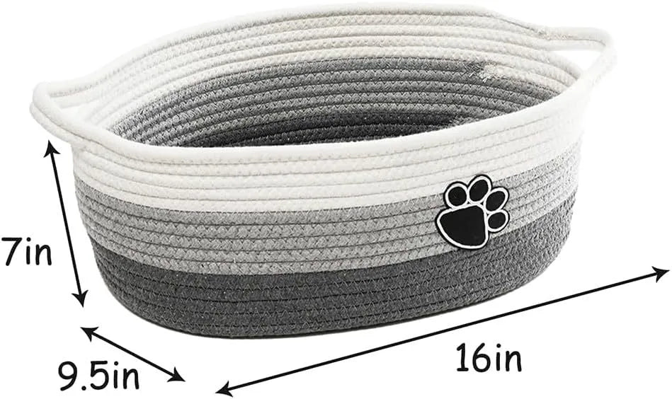 Light beige handmade woven cotton rope storage basket with wooden handle.
