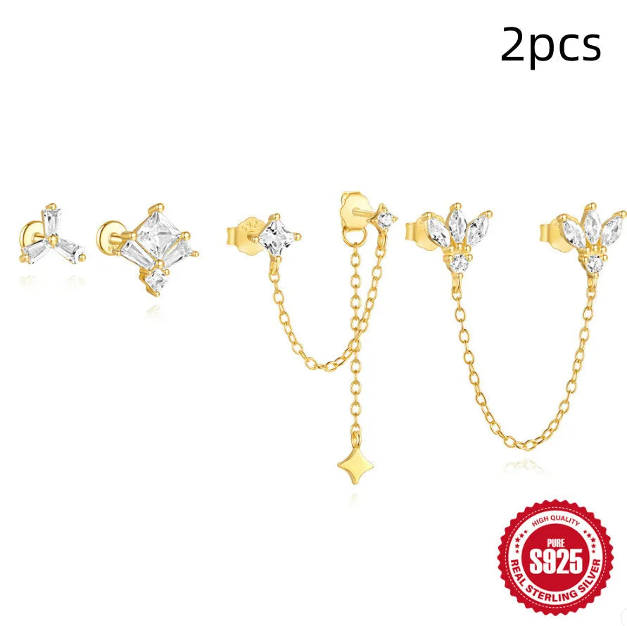 S925 sterling silver stud earring with golden double piercing design and zircon inlaid detail on a white background.