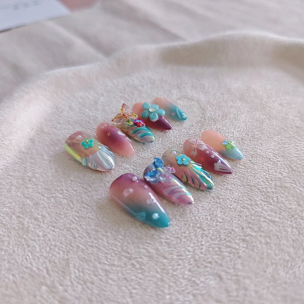 Handmade small flower and butterfly nail art charms in assorted sizes for gel manicure decoration.