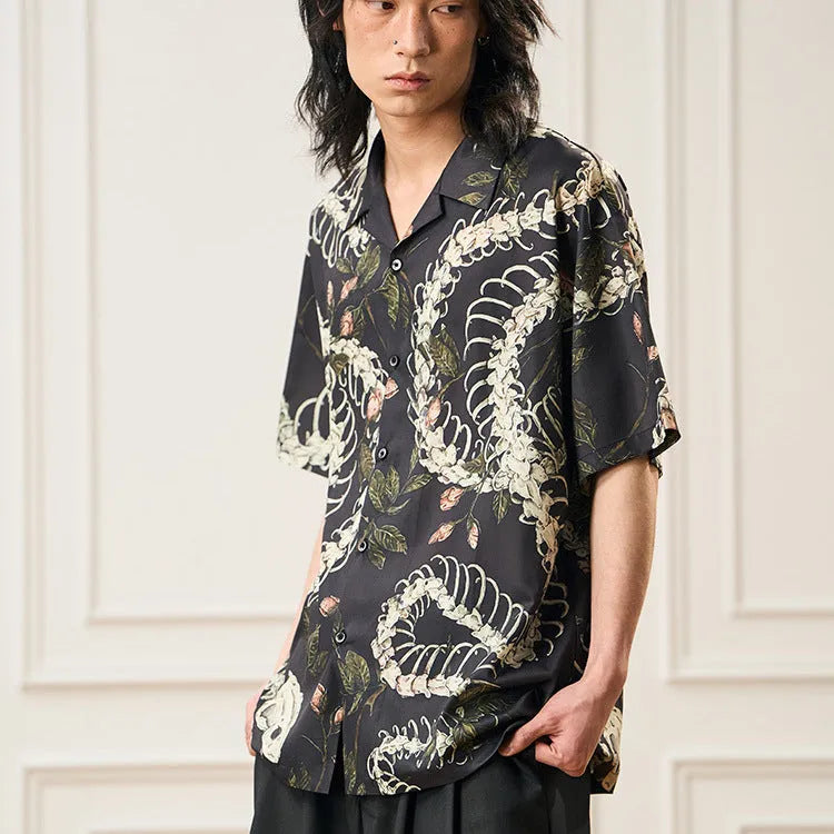Short sleeve Cuban collar shirt with a printed snake bone and floral pattern in a loose fit.