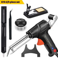 Handheld electric soldering gun with plastic handle, anti-static tweezers, and desoldering tool on a workbench