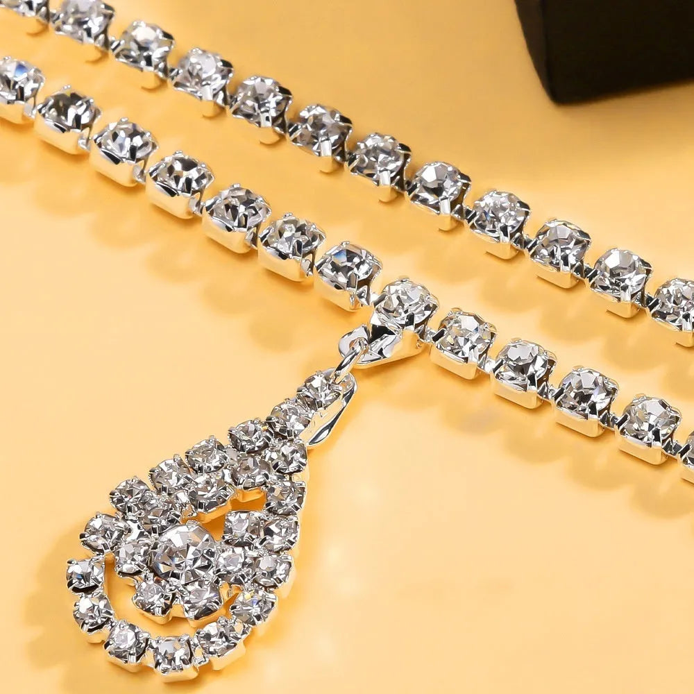 Women's rhinestone waist chain with water drop pendant showing gold and silver colour options