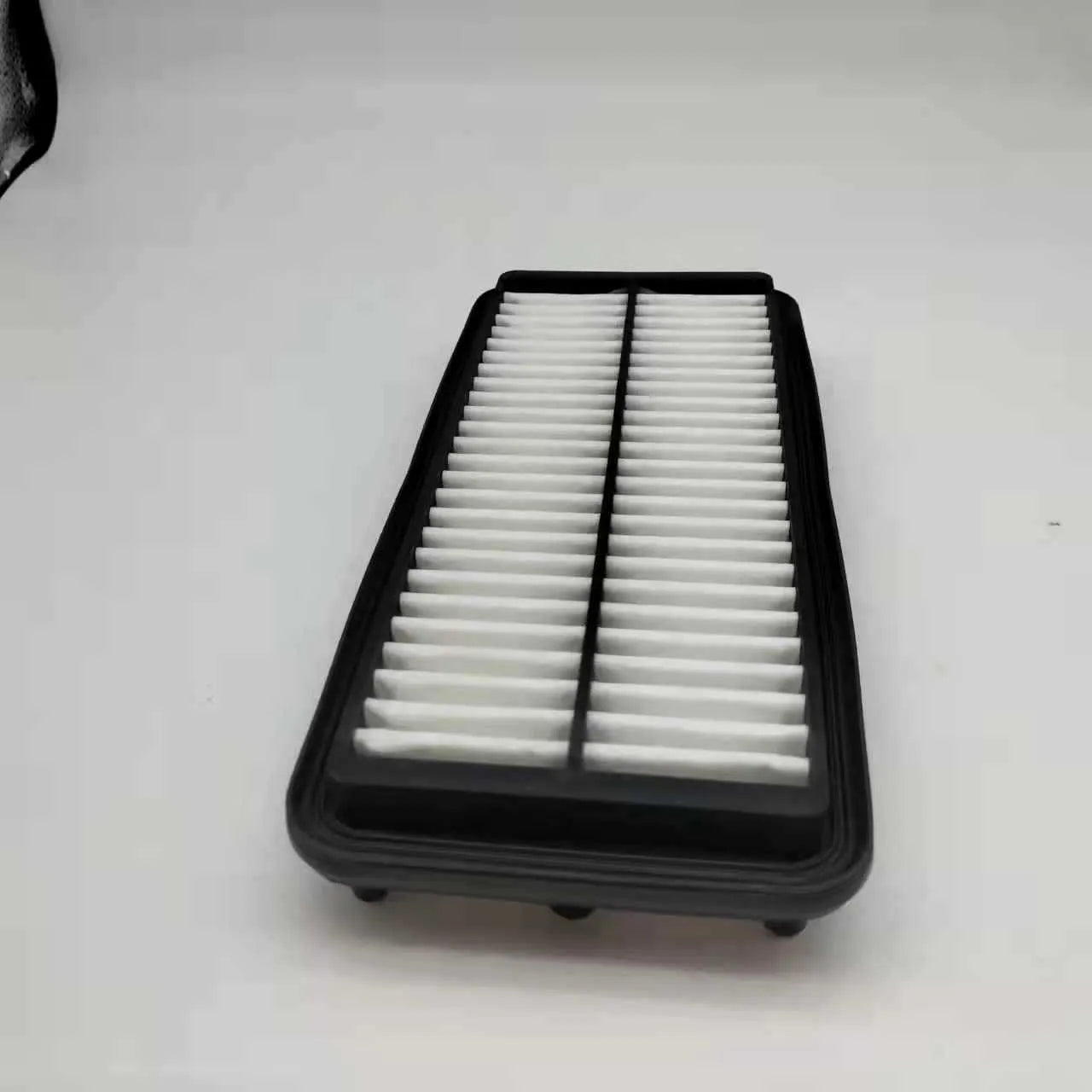 Black rectangular car air filter measuring 256mm by 113mm by 40mm dimensions