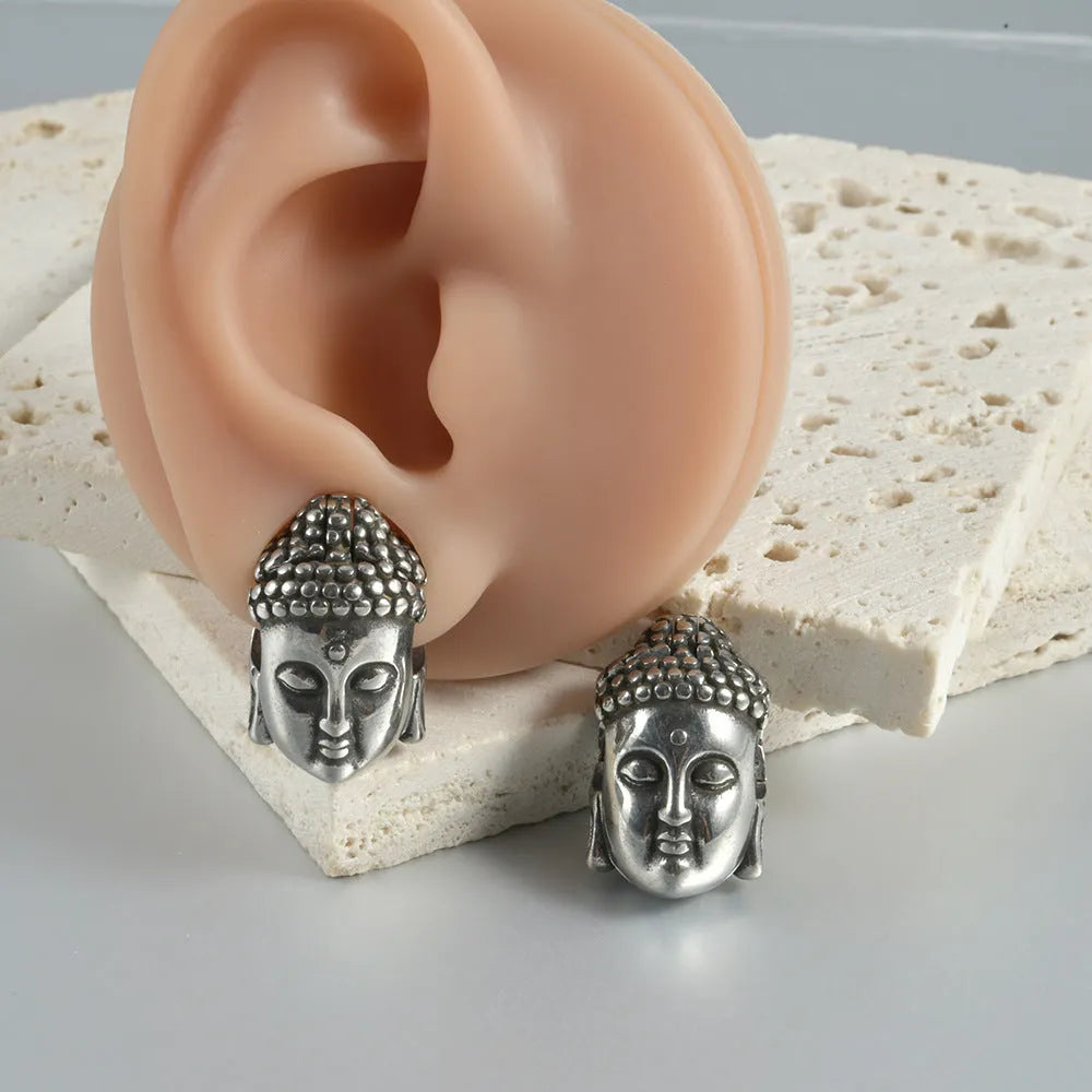 Stainless steel hollow skull Buddha earring in a geometry shape, shown in one of four colour options.