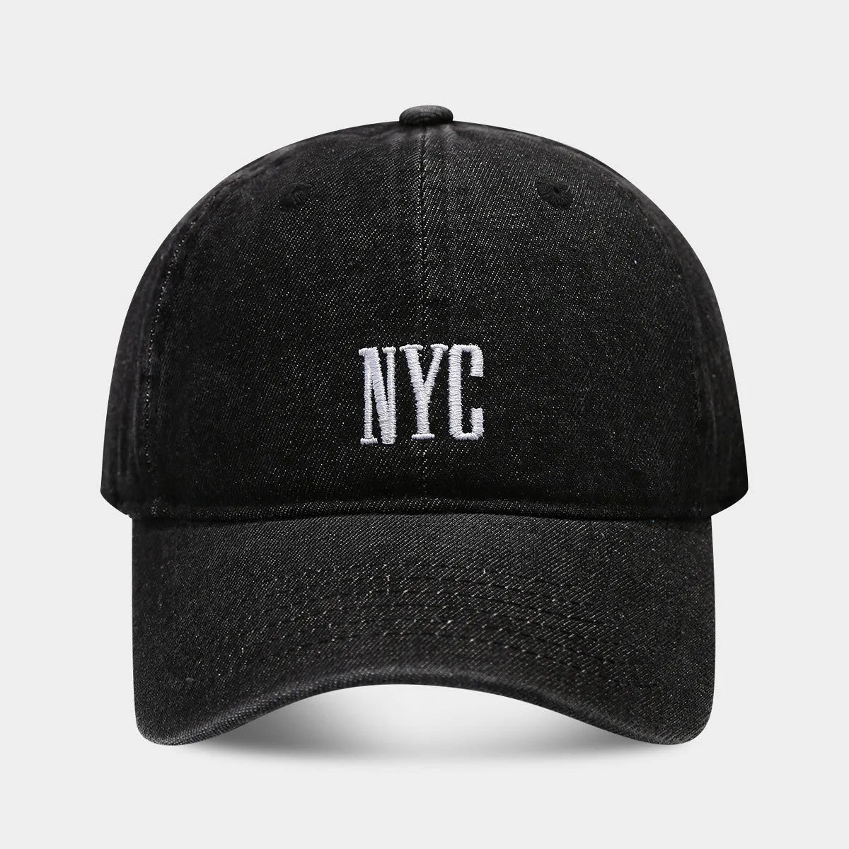 Retro denim peaked cap with embroidered letters on the front, shown in an adjustable size.