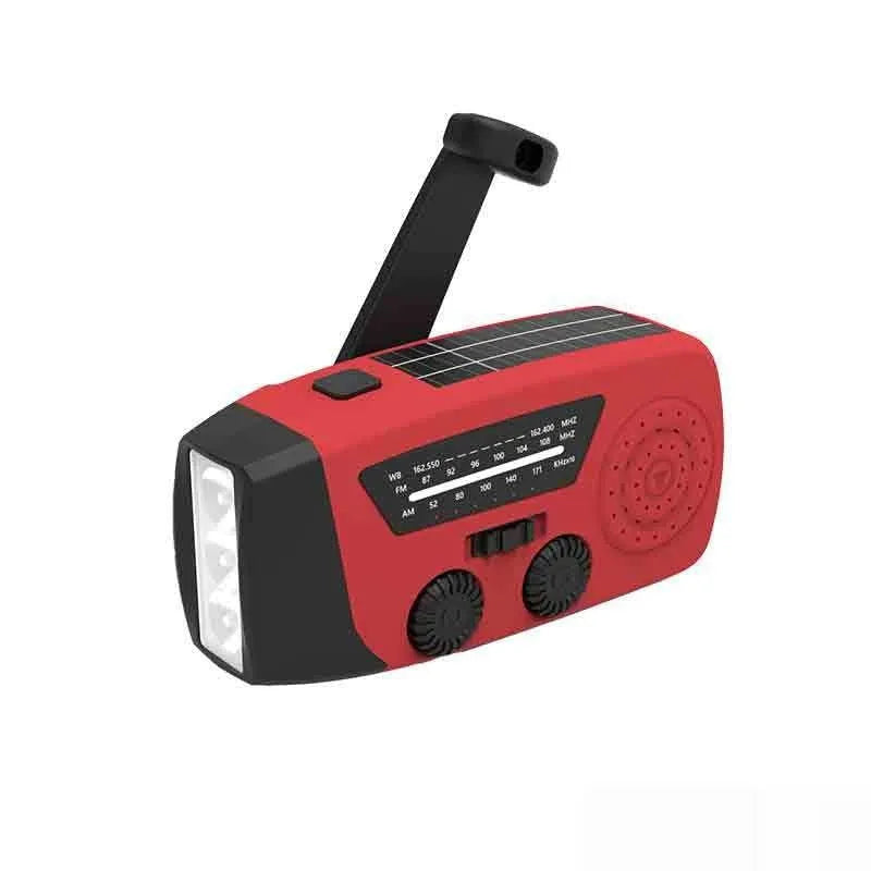 Red rechargeable hand-held emergency radio with integrated torch and wrist strap.