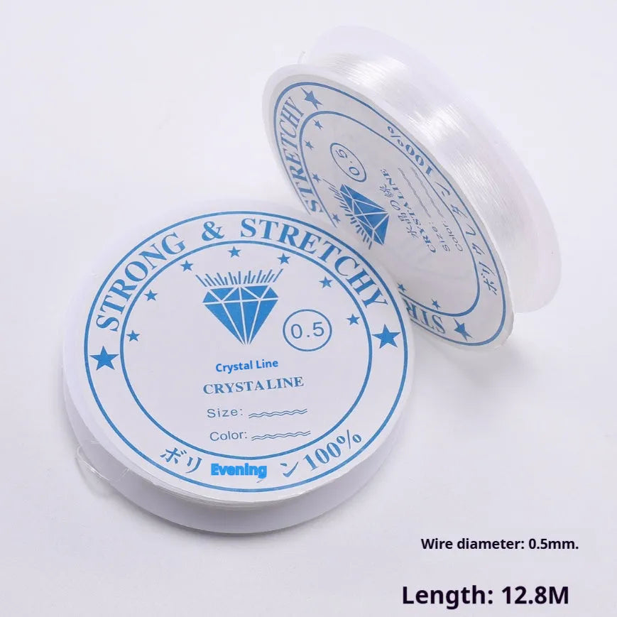 Coil of transparent white elastic fishing line cord for DIY jewellery and ornament making.