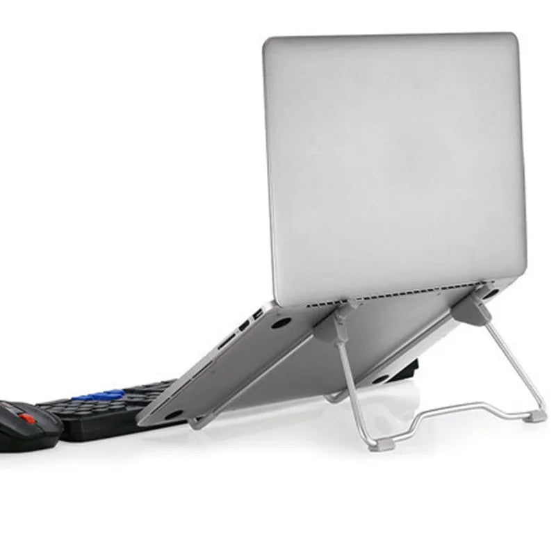 Grey adjustable aluminium alloy stand holding a mobile phone on a desk.