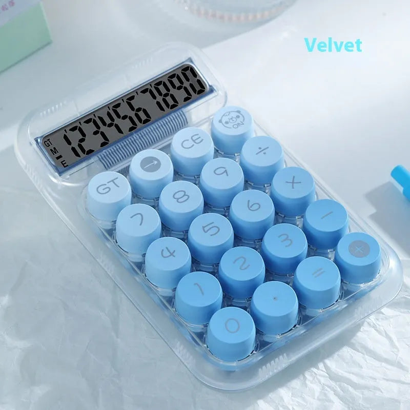 Round keypad gradient colour calculator in blue, green, pink, or purple on a desk.