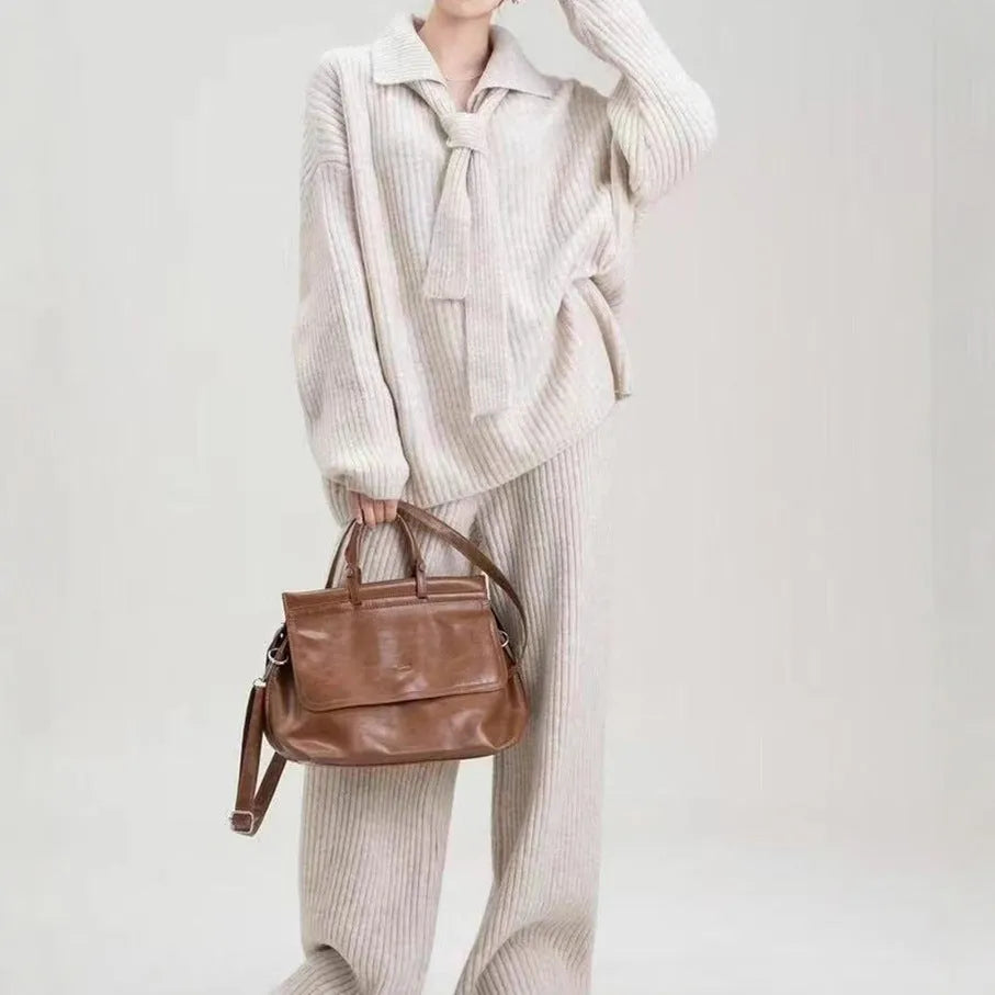 Acrylic fibre sweater suit two-piece set in beige, showing knitted top and casual trousers.