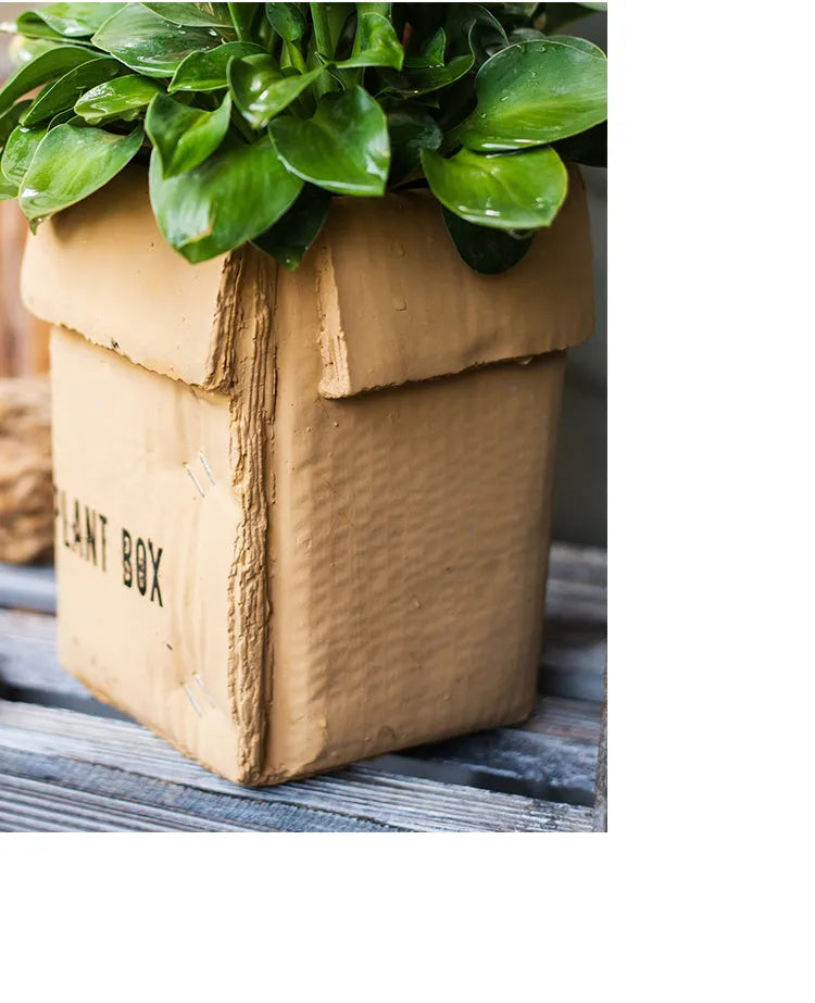 Cement flowerpot with perforated base and Nordic brown paper box design