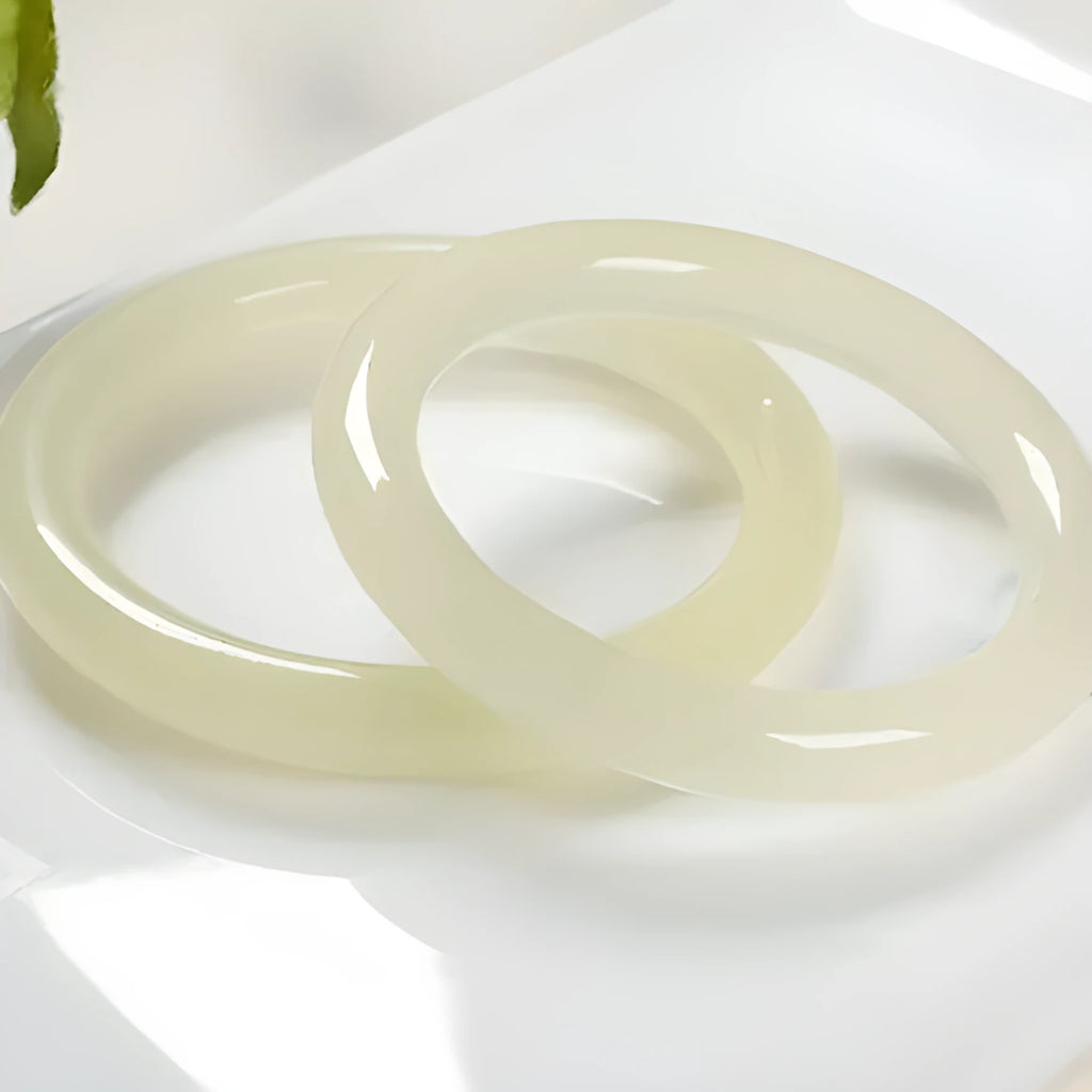 Solid ice silk jade round bar bracelet showing smooth geometric shape on a plain background
