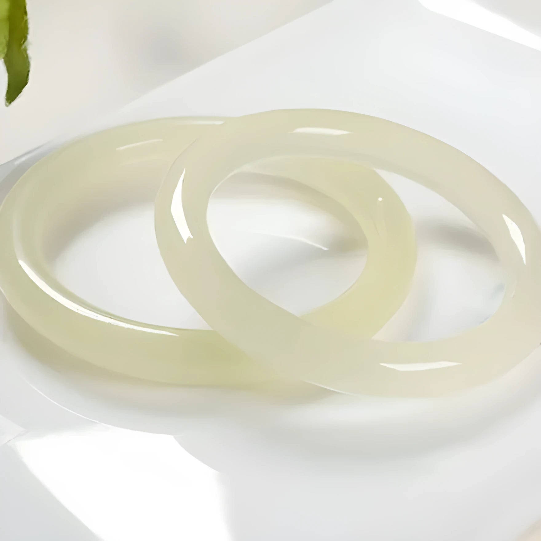 Solid ice silk jade round bar bracelet showing smooth geometric shape on a plain background