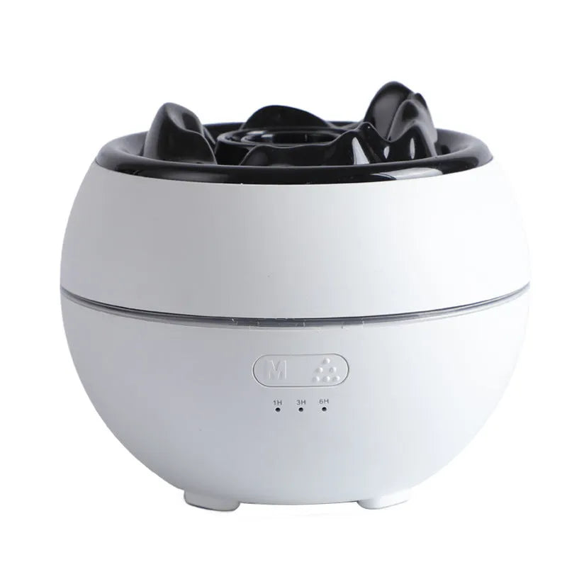 White round flame aroma diffuser humidifier with timer settings on a desk.