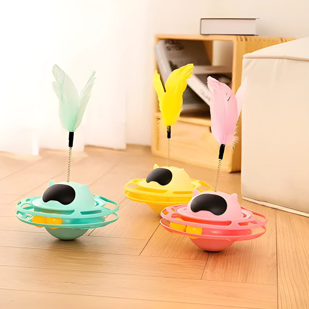 Pink cat tumbler turntable toy with rotating platform and dangling cat stick for interactive feline play
