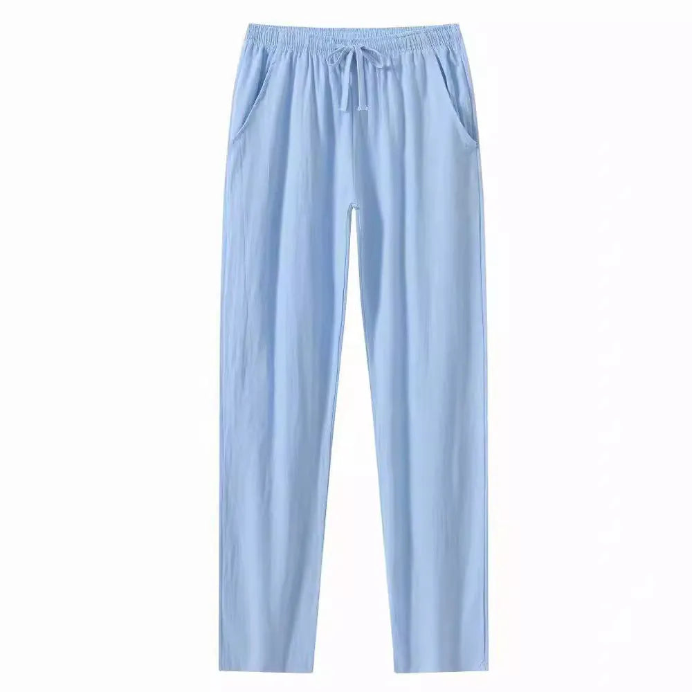 Men's loose-fit cotton beach trousers in solid white, sky blue, khaki, or black colours.