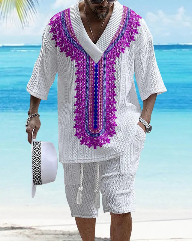 Man wearing a printed drop-shoulder knitted short-sleeve jacket with matching shorts in a casual setting.