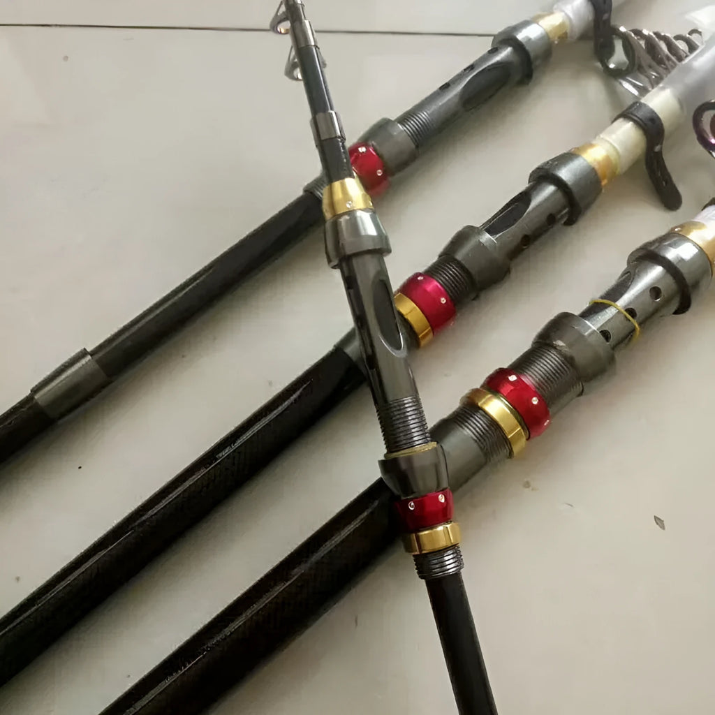 Carbon fibre telescopic spinning fishing rod with metal handle, extended, on a boat deck.