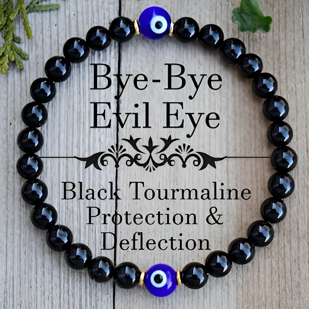 Men's black 8mm devil's eye obsidian beaded bracelet with geometric pattern on table