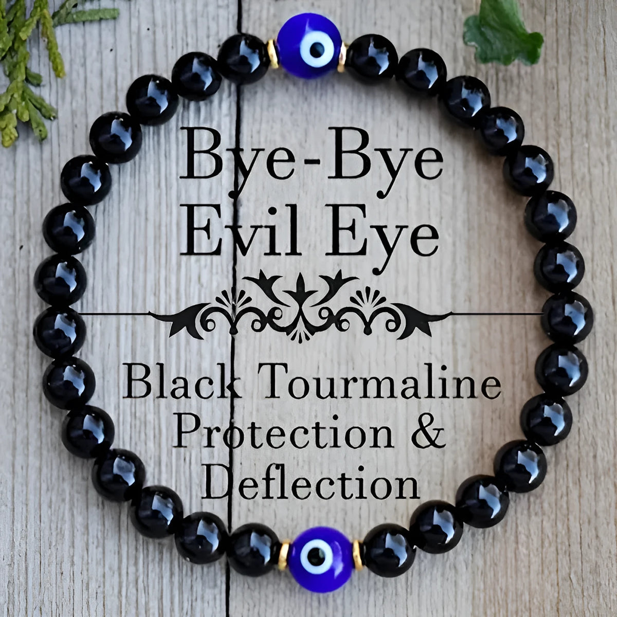 Men's black 8mm devil's eye obsidian beaded bracelet with geometric pattern on table