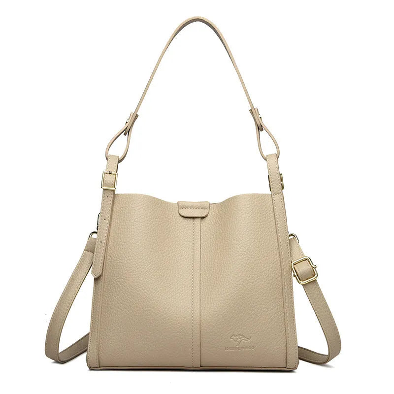 Brown retro ladies shoulder bag with zip compartments showing vertical square shape and single strap