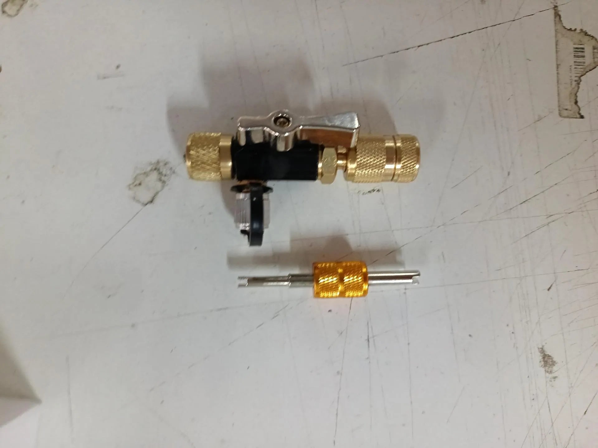 Vacuum valve core disassembly tool set with black and pink valve removers and metal construction