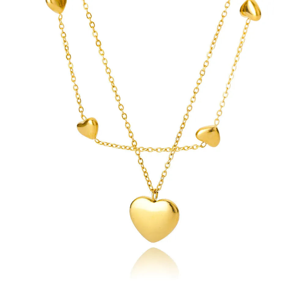 Multilayer heart pendant necklace with moon and star zircon accents on copper O-ring chain