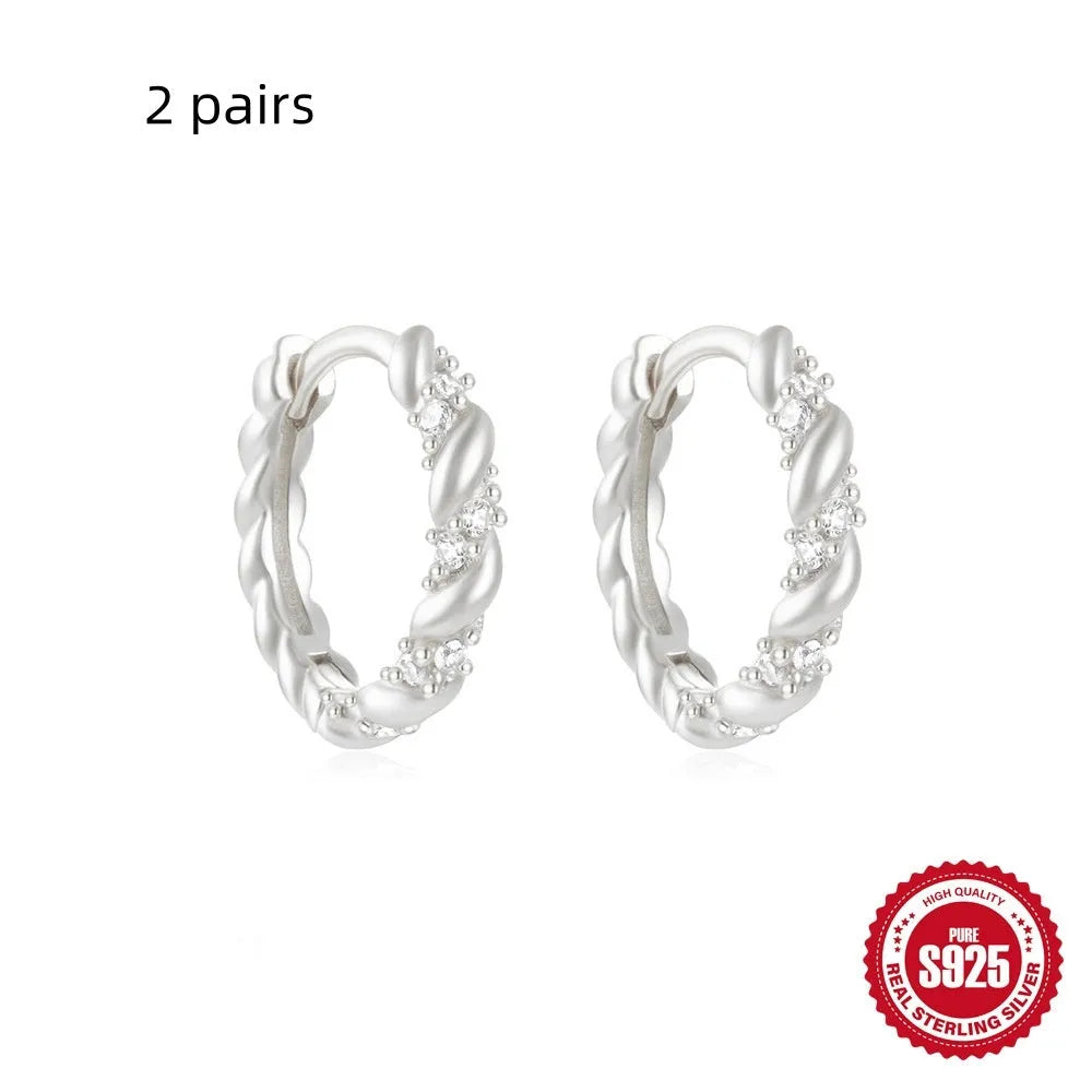Small round geometric sterling silver stud earrings with diamond accents in gold or silver finish